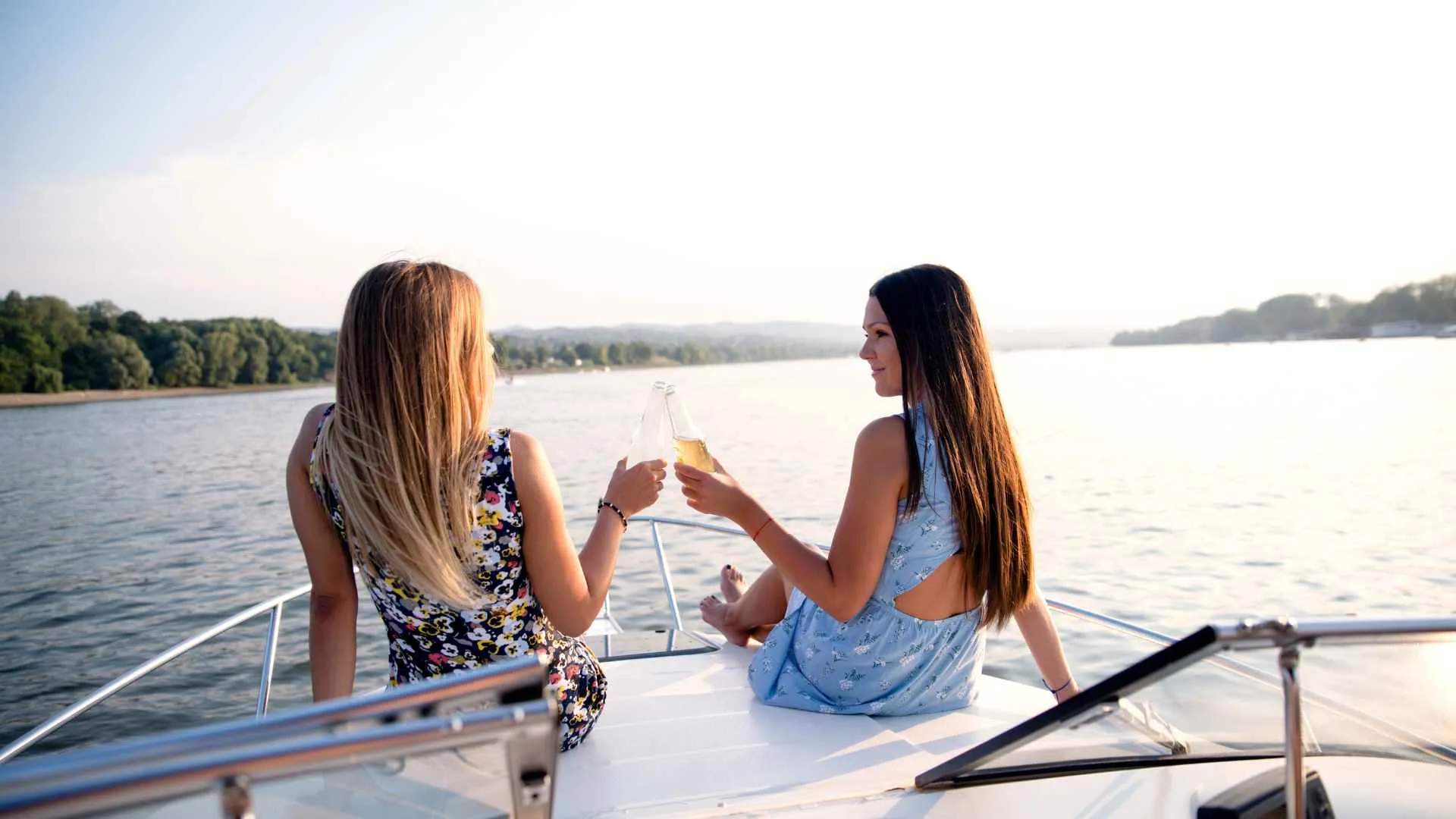 girls toasting during sunset cruise