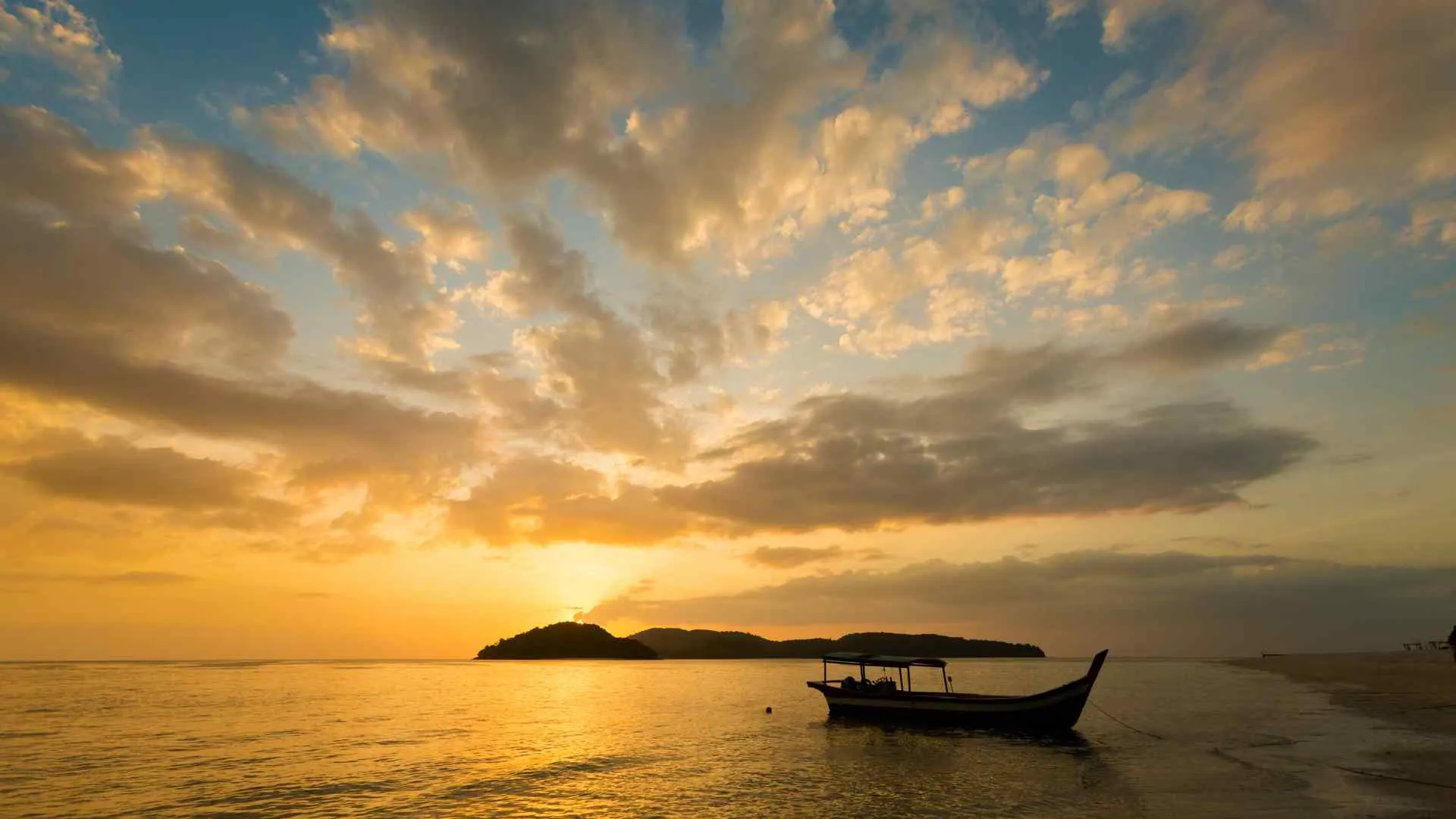 wooden boat Langkawi sunset