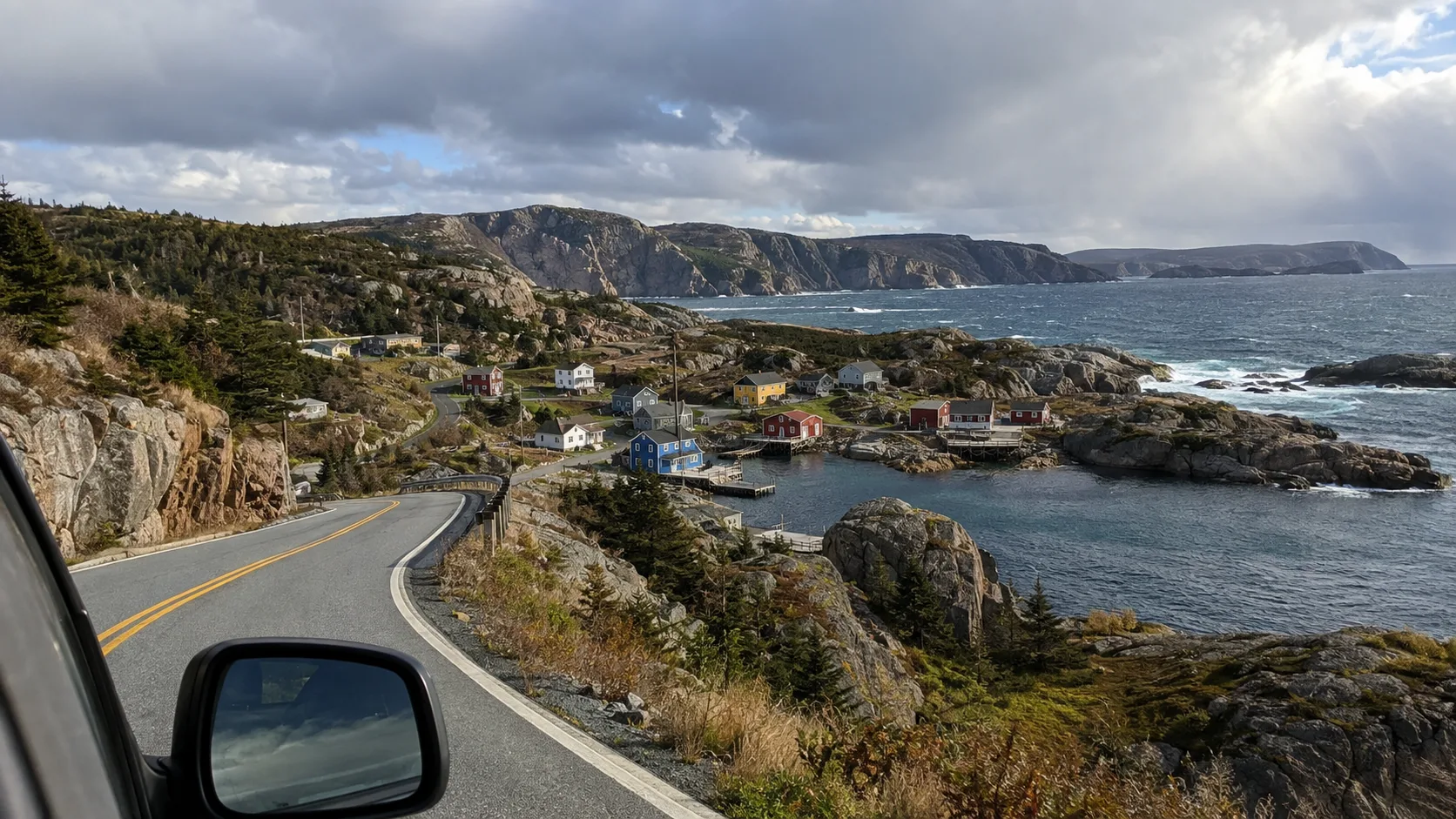 Quiet coastal road winding past fishing villages in eastern Newfoundland