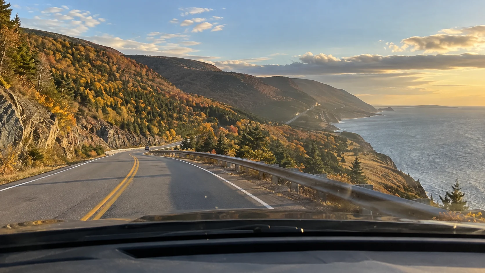 Driver's-eye view of the Cabot Trail curving above the Cape Breton coast