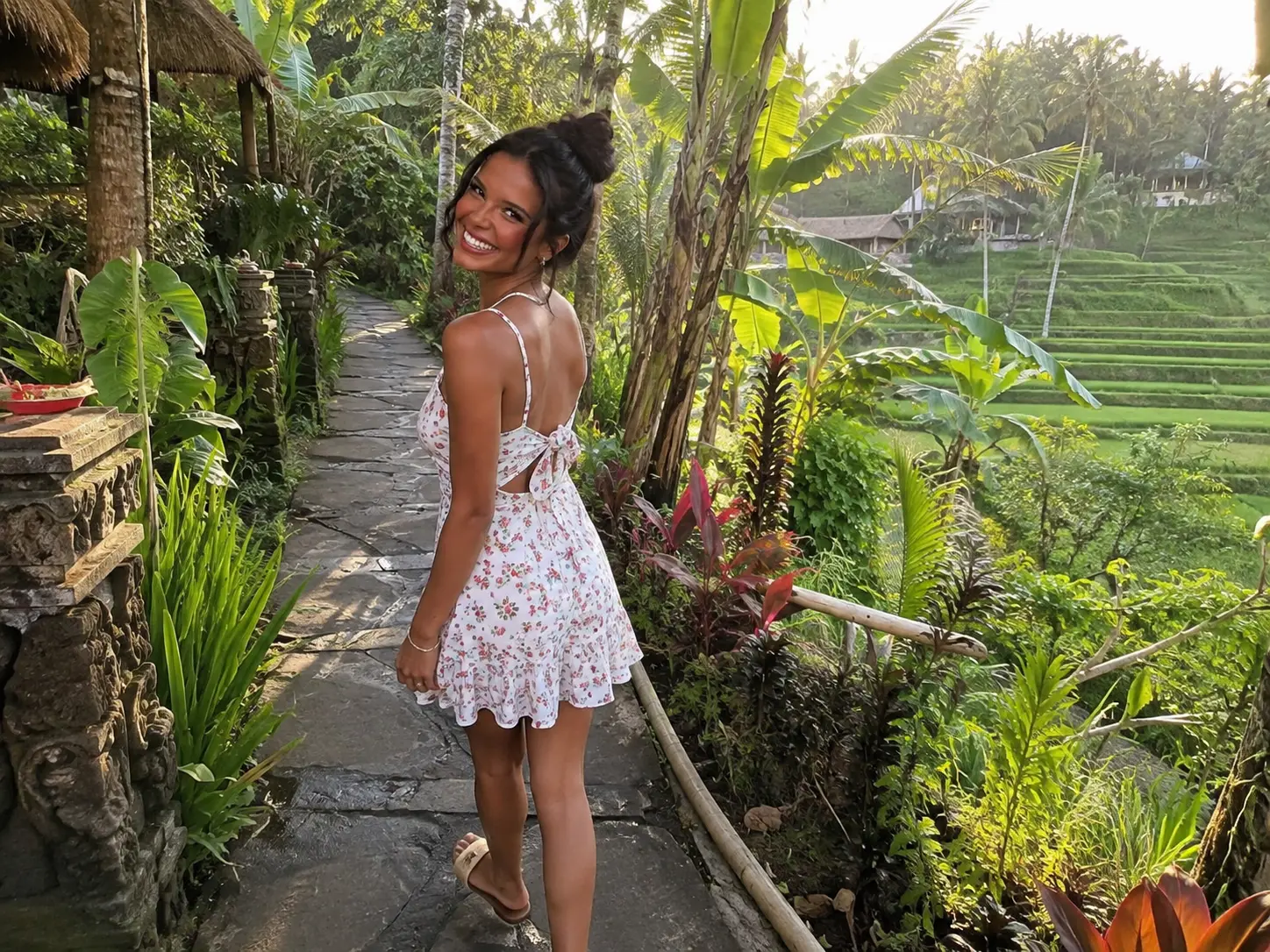Ellie Simons walking beside rice terraces in Bali