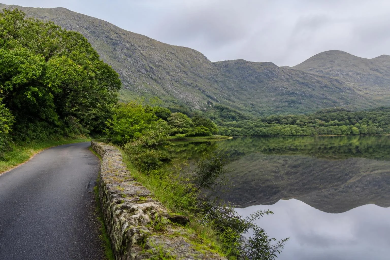 Lake and mountains beside a quiet road in Killarney National Park