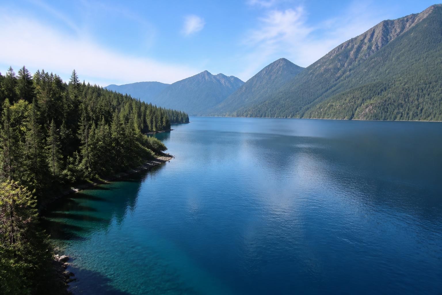 Blue water and forested mountains at Lake Crescent