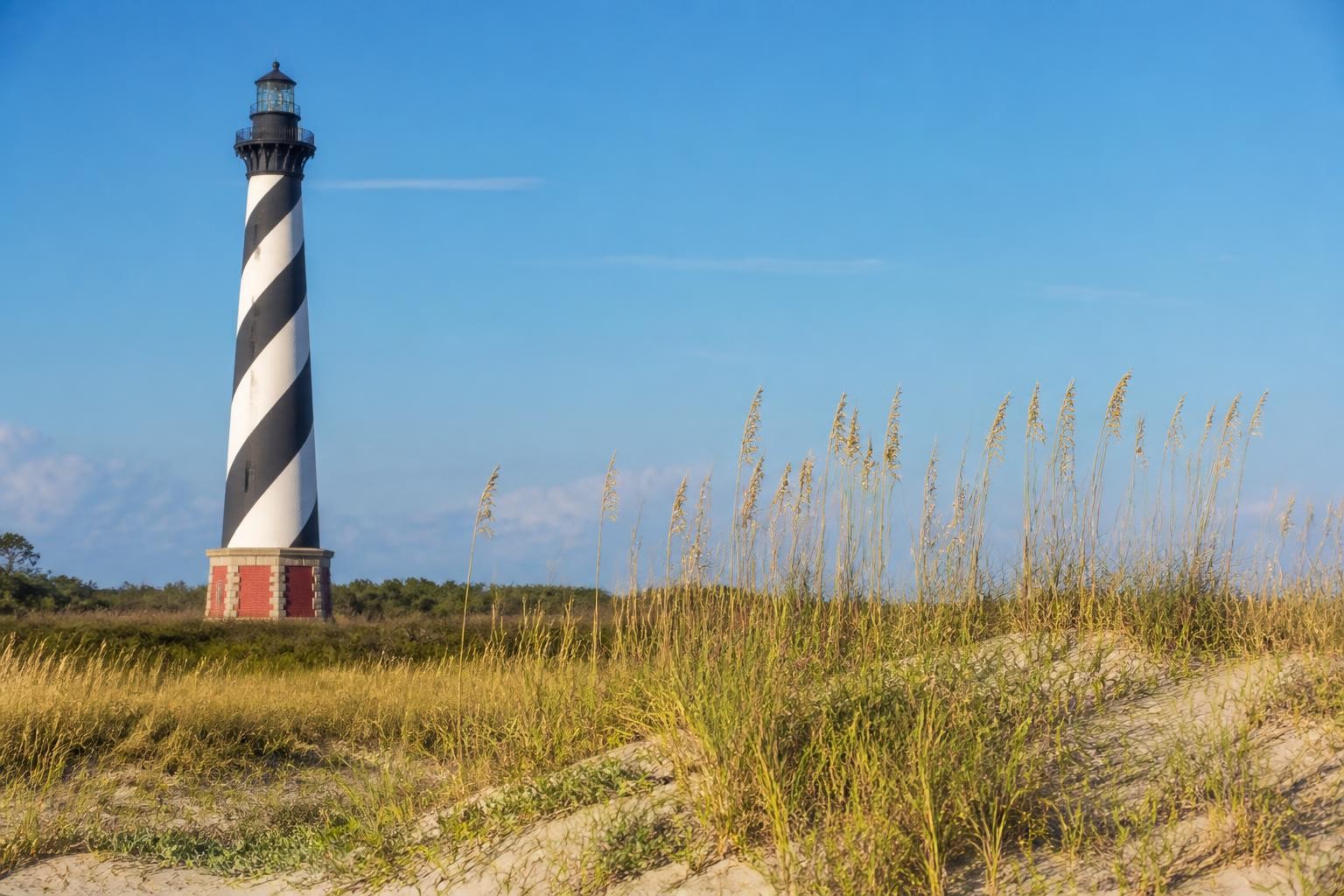Cape Hatteras Lighthouse beyond dunes and sea oats