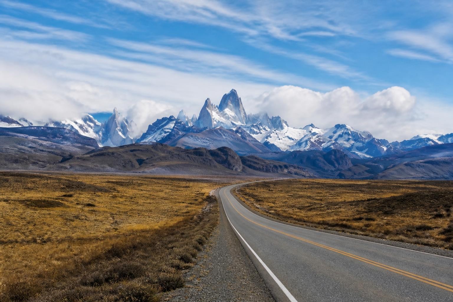 Road across Patagonian steppe toward Mount Fitz Roy near El Chalten