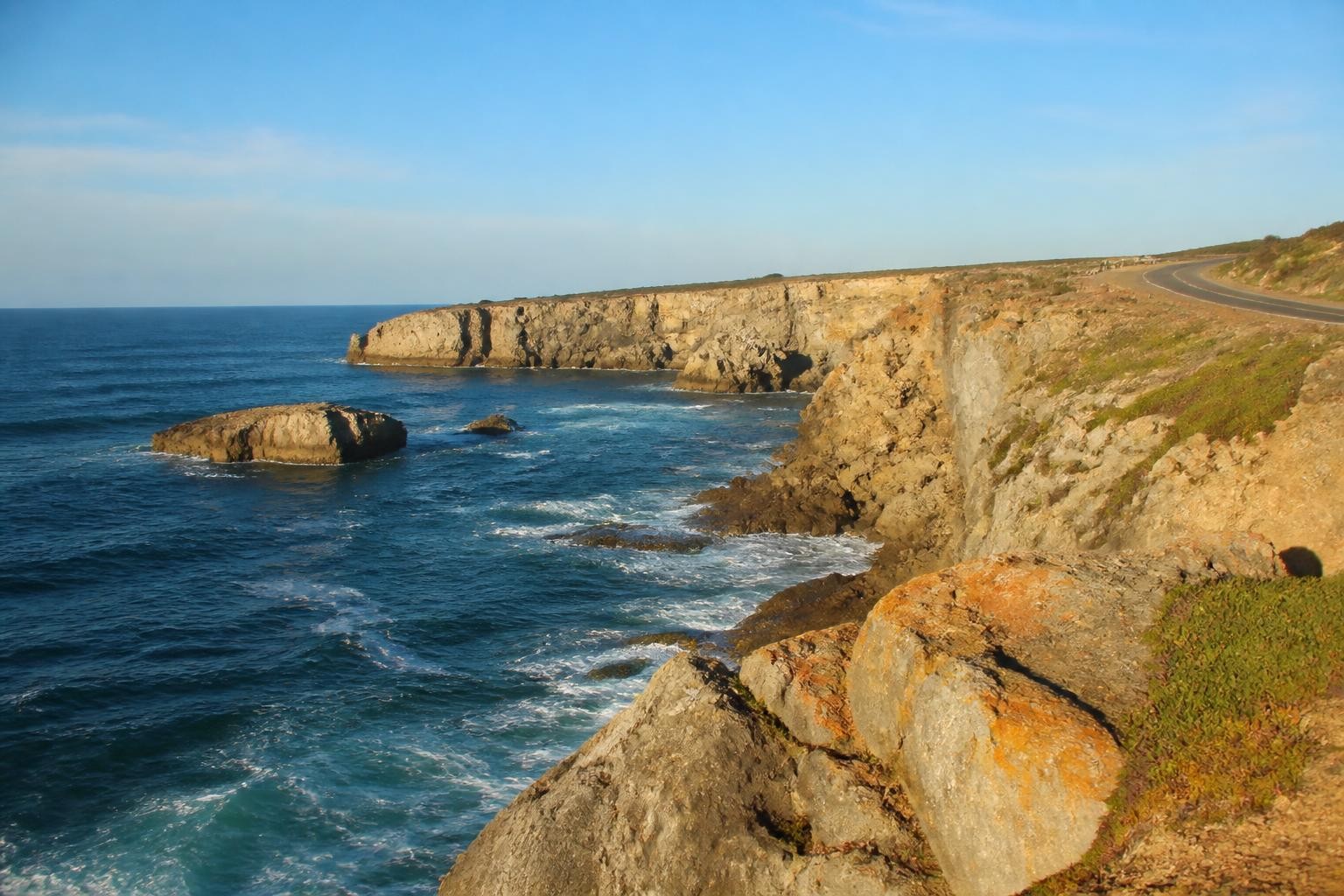 Rugged Atlantic cliffs and surf near Peniche Portugal