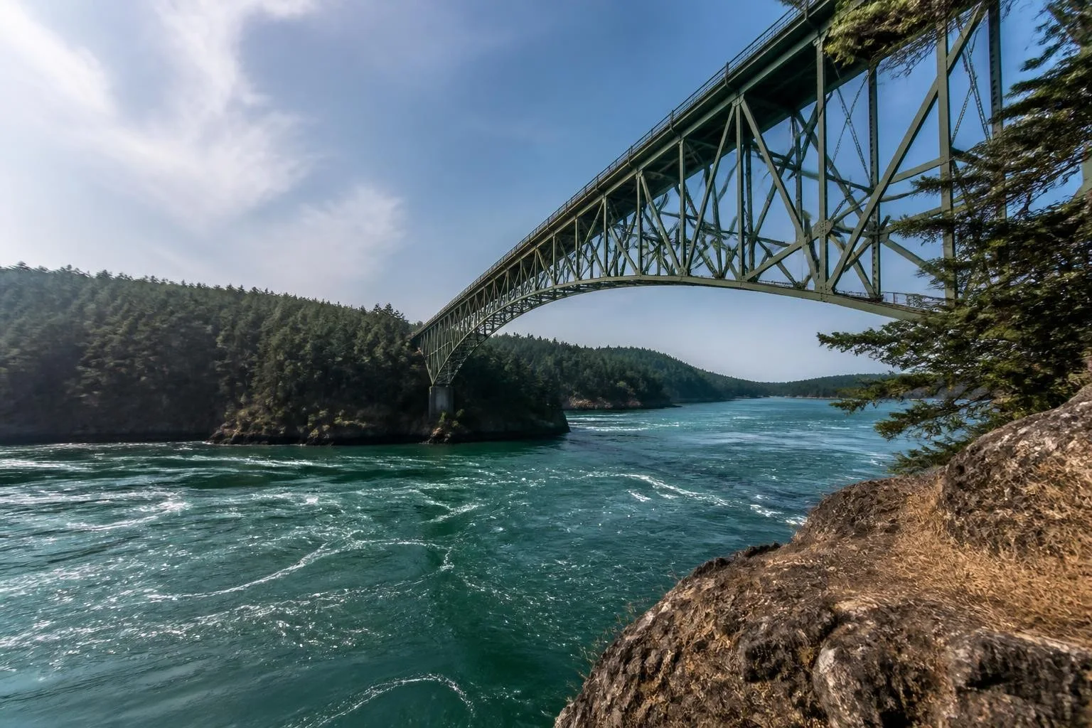 Deception Pass Bridge between forested Whidbey Island shores