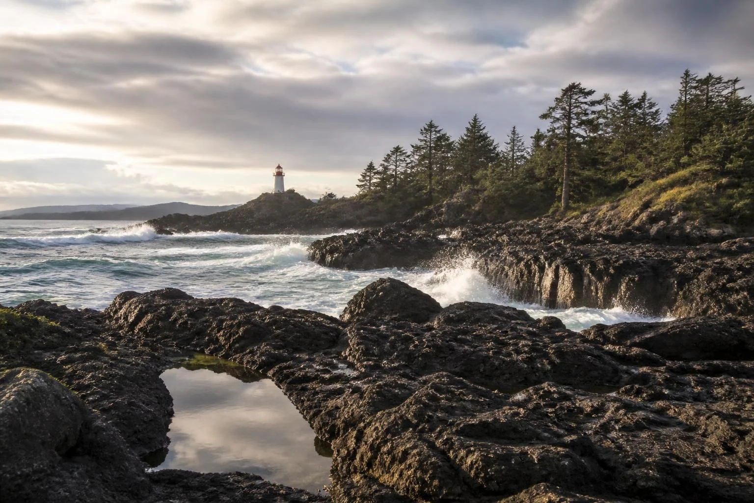 Rugged Pacific shoreline and lighthouse near Ucluelet Vancouver Island