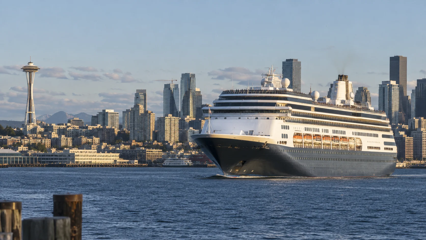 Cruise ship departing Seattle with the Space Needle visible beyond Elliott Bay
