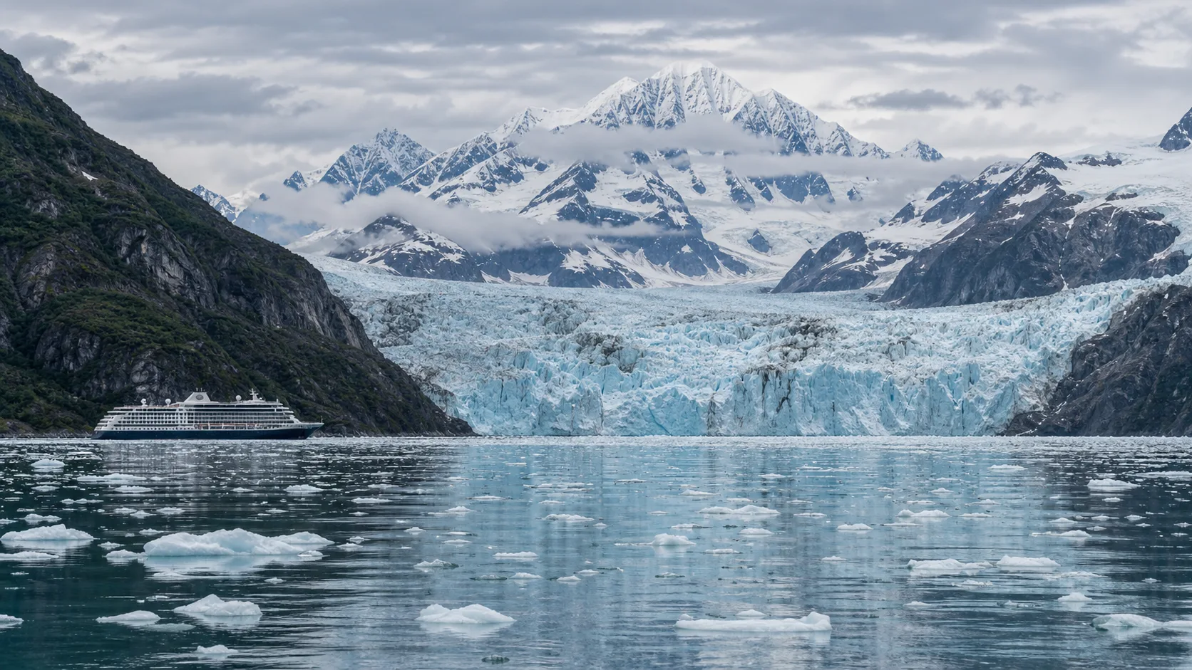 Cruise ship viewing tidewater glaciers and snowy peaks in Glacier Bay National Park
