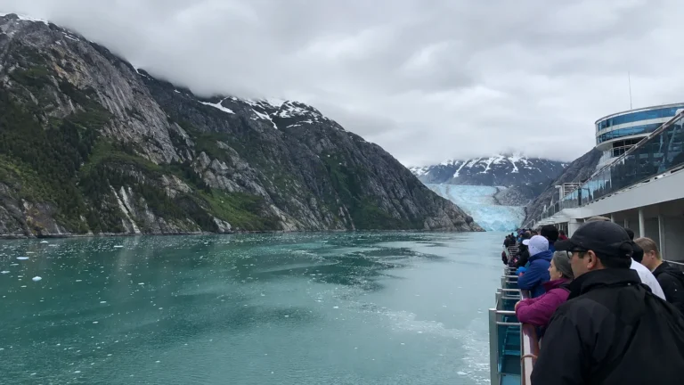 Glacier and icy bay with a cruise ship alongside