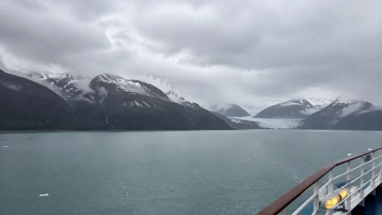 Glacial bay and snowy mountains viewed from a cruise ship