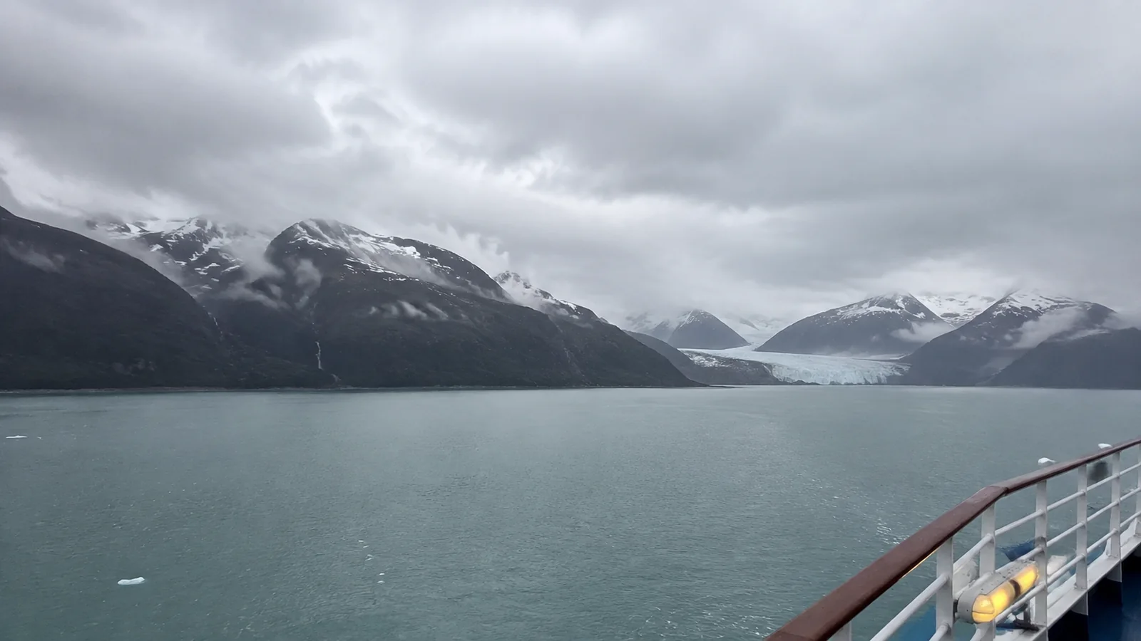 Glacial bay and snowy mountains viewed from a cruise ship