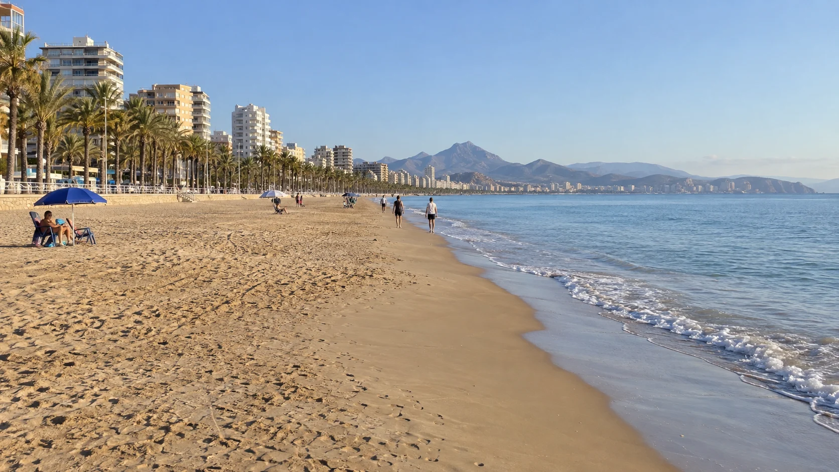 Playa de San Juan stretches beside a palm-lined promenade in Alicante.