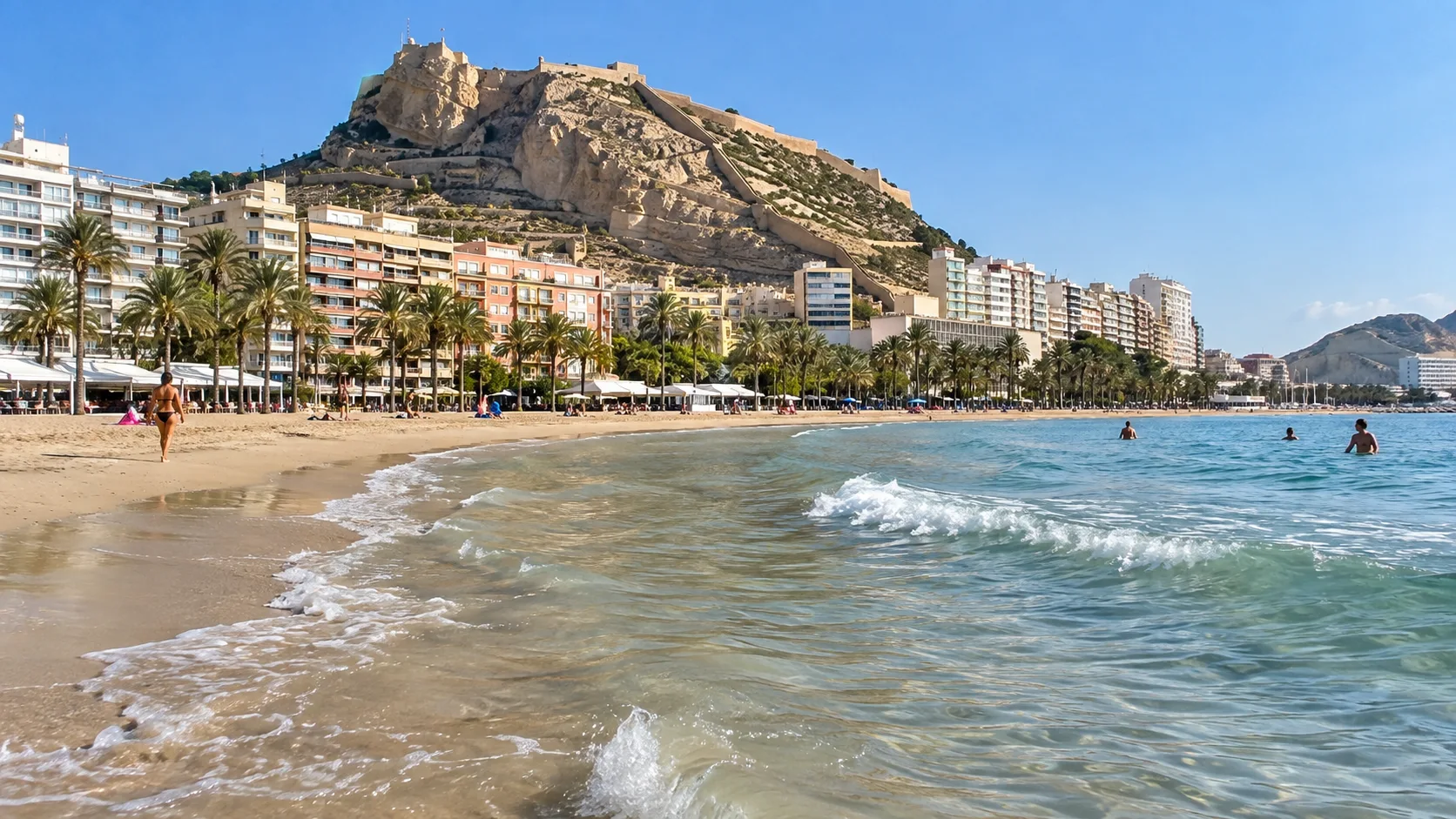 Postiguet Beach lies beneath Mount Benacantil and Santa Bárbara Castle.