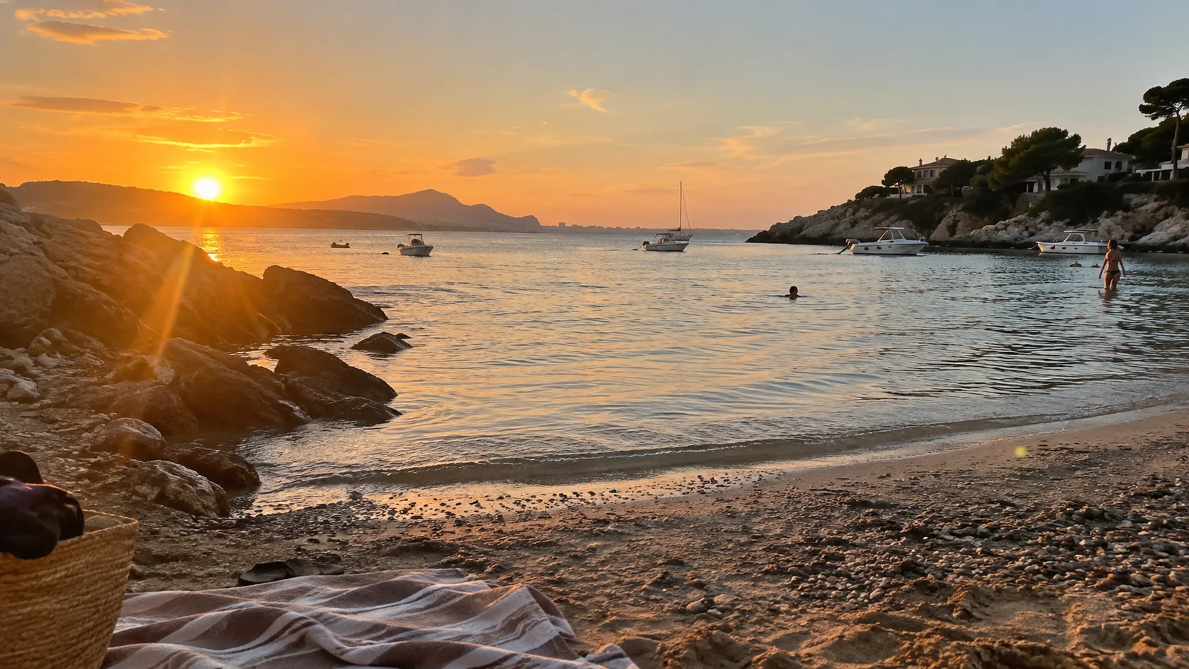 Warm sunset light reflects across the calm water at Almadraba Beach.