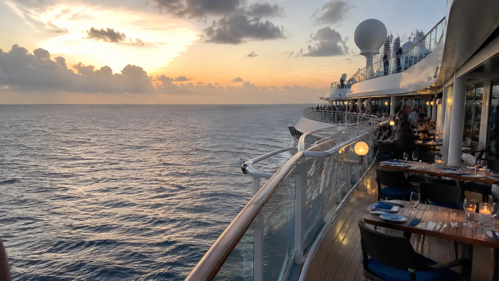 Cruise ship exterior deck overlooking the ocean at sunset