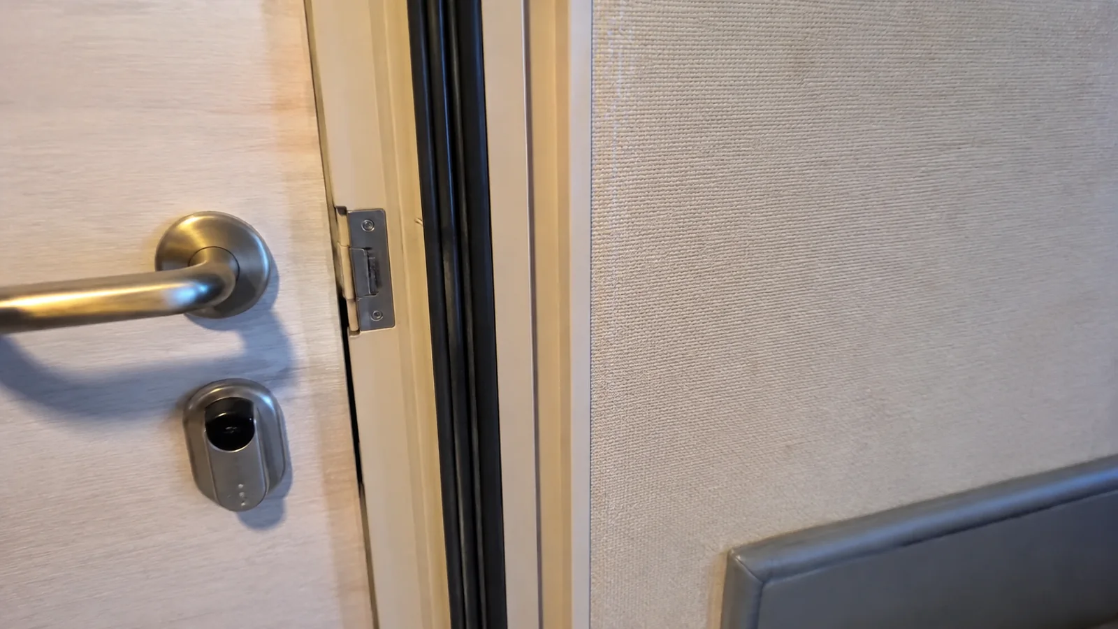 Close-up of a cruise cabin door handle and lock