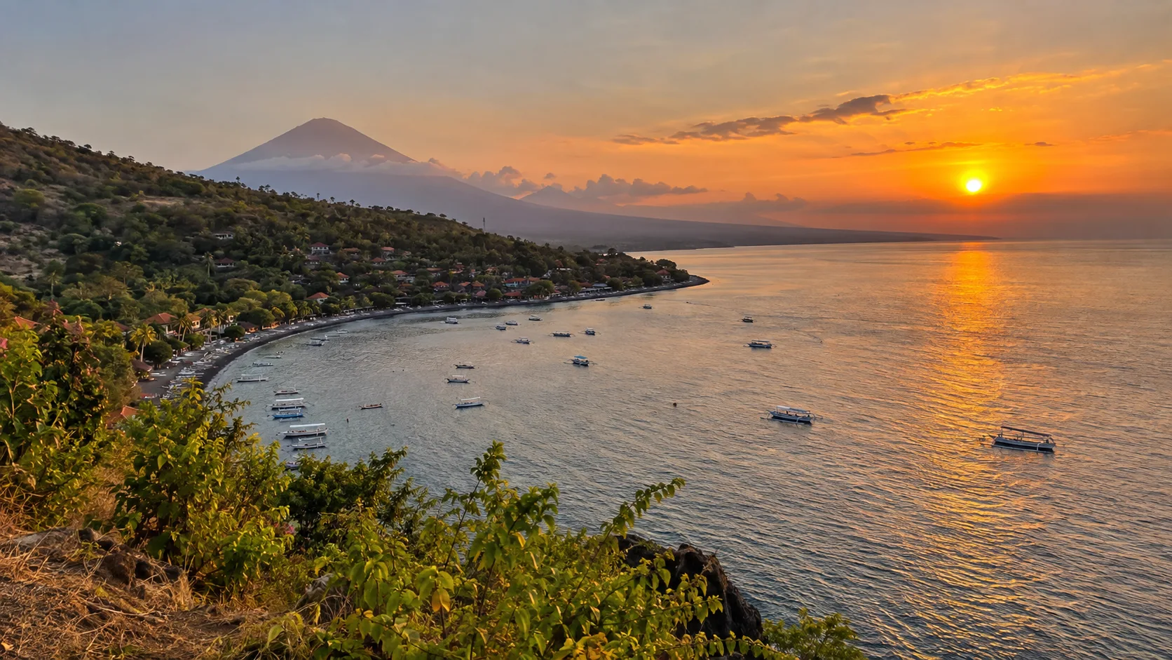 Sunset view over Jemeluk Bay and the Amed coastline.