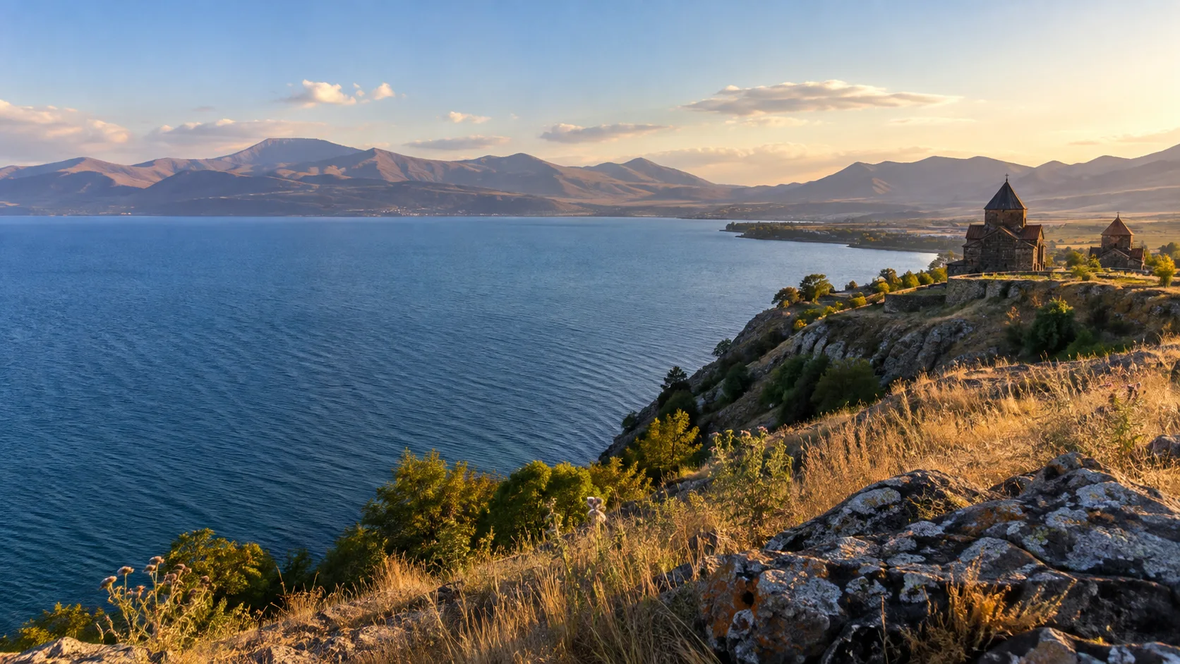 Lake Sevan and Sevanavank's stone churches glow beneath mountain ridges.
