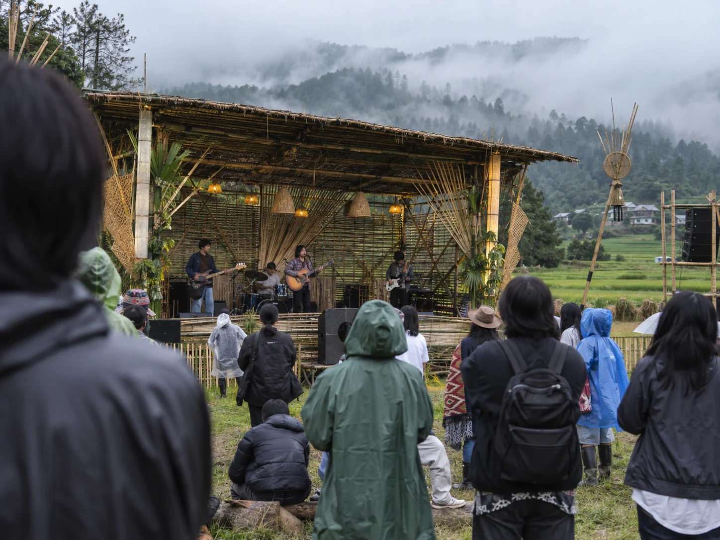 Festivalgoers watch a band on a bamboo stage at Ziro Festival of Music.
