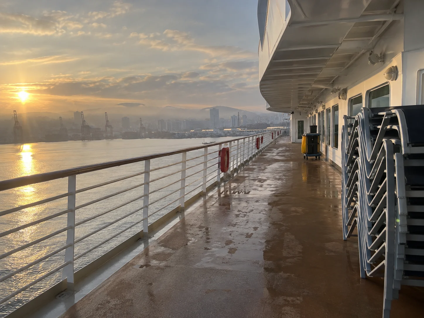 Nearly empty cruise ship promenade during a quiet turnaround morning