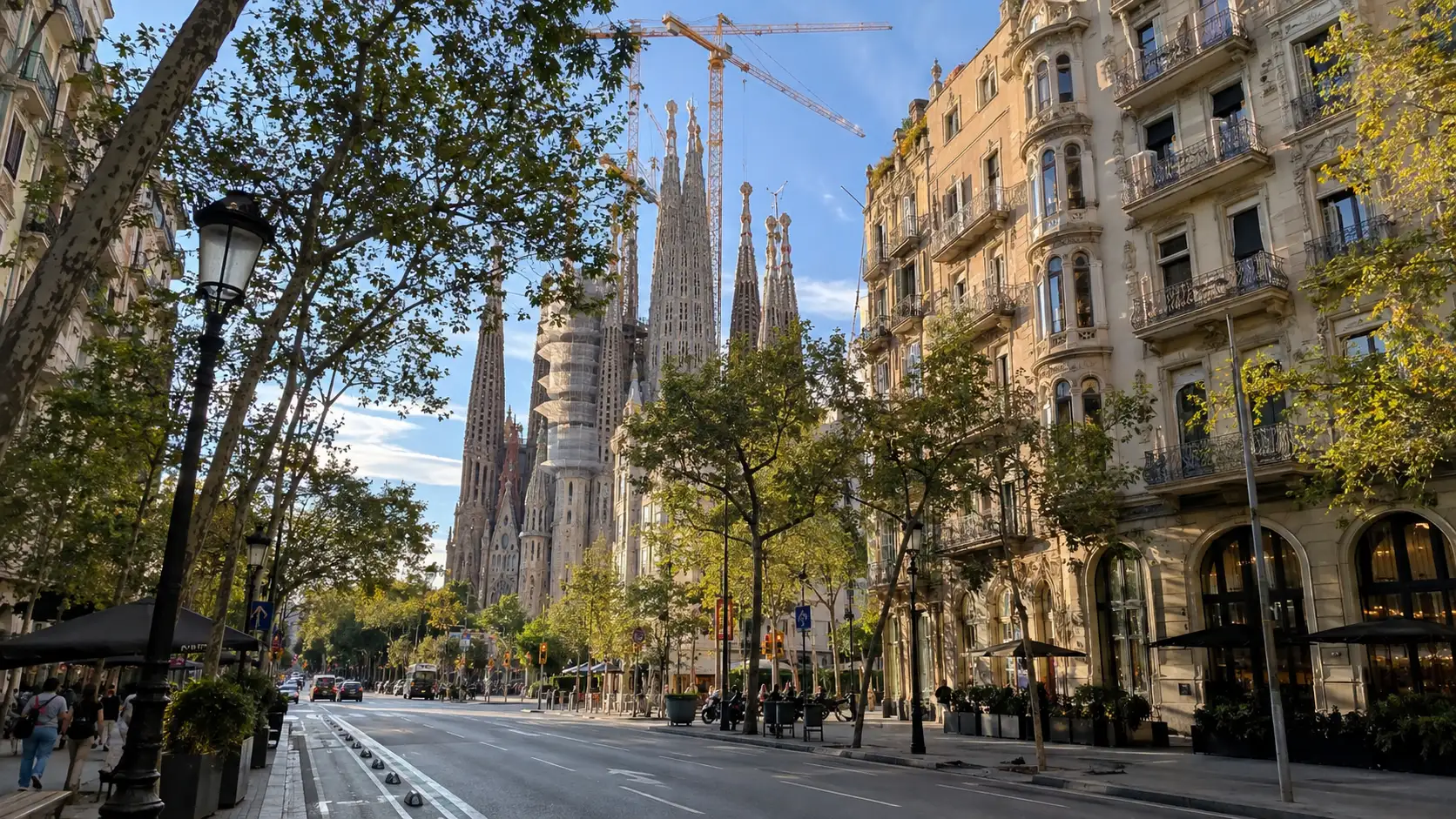 Sagrada Família viewed along an Eixample avenue in Barcelona.