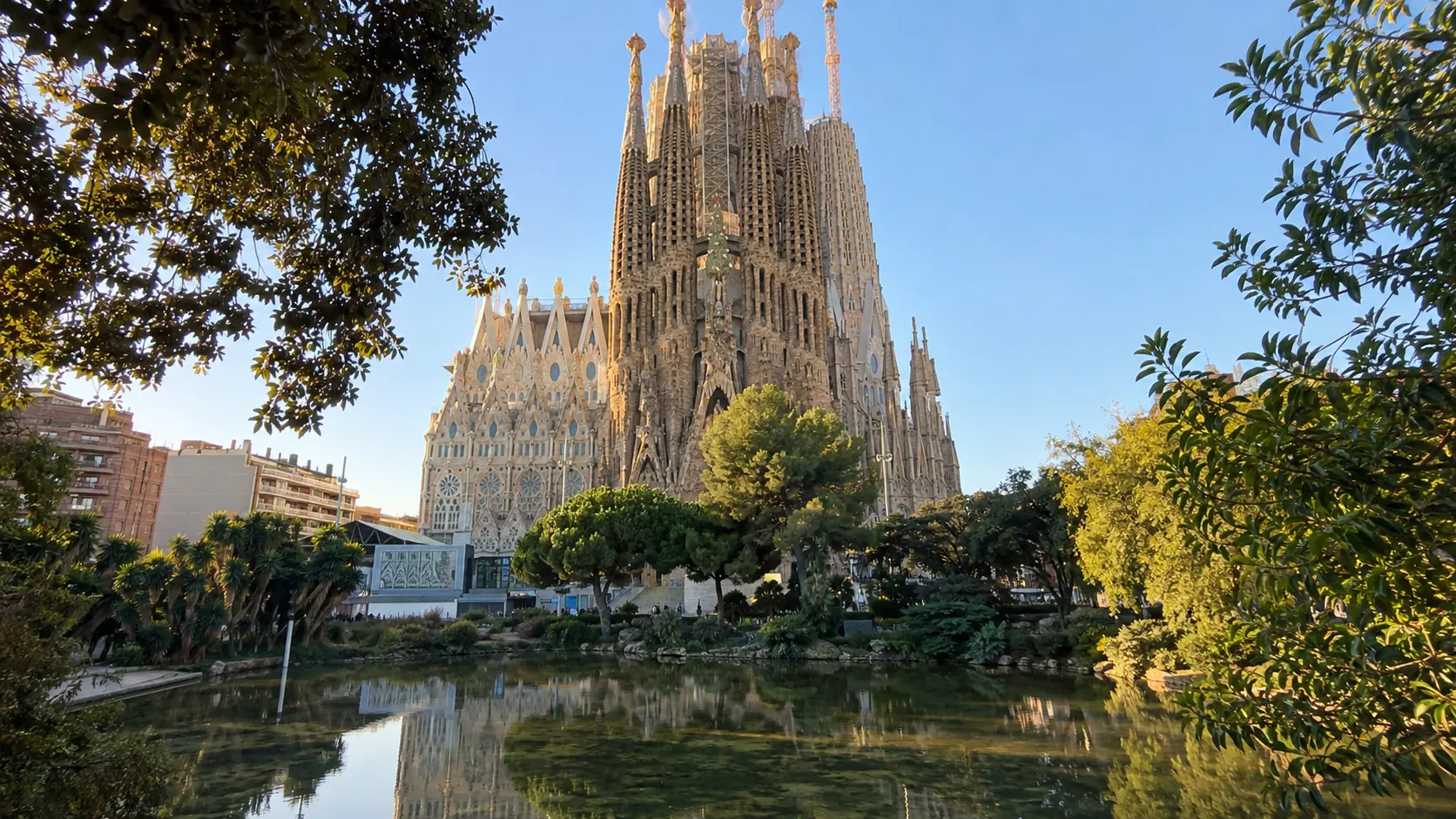 Sagrada Família basilica viewed from the park in morning light.