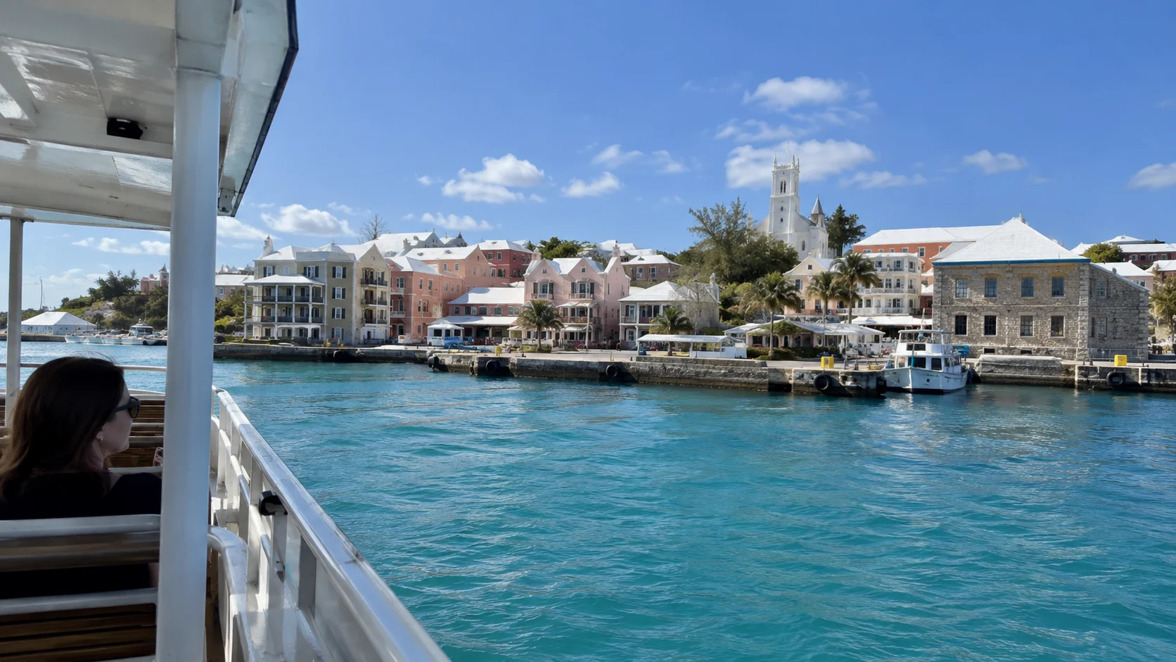 Small ferry approaching the historic harbor in St. George's.