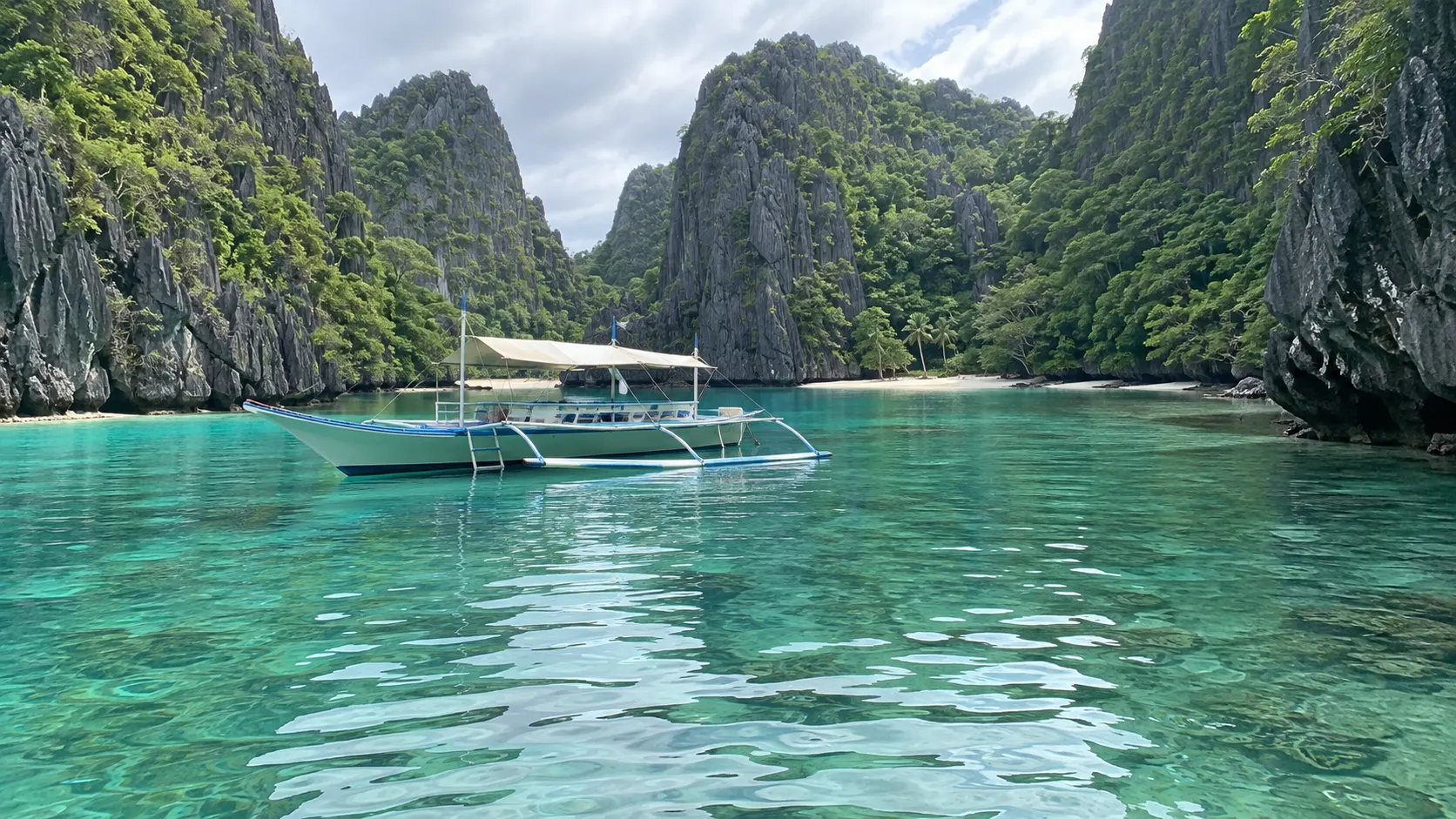 Outrigger boat in a limestone lagoon in Palawan, Philippines