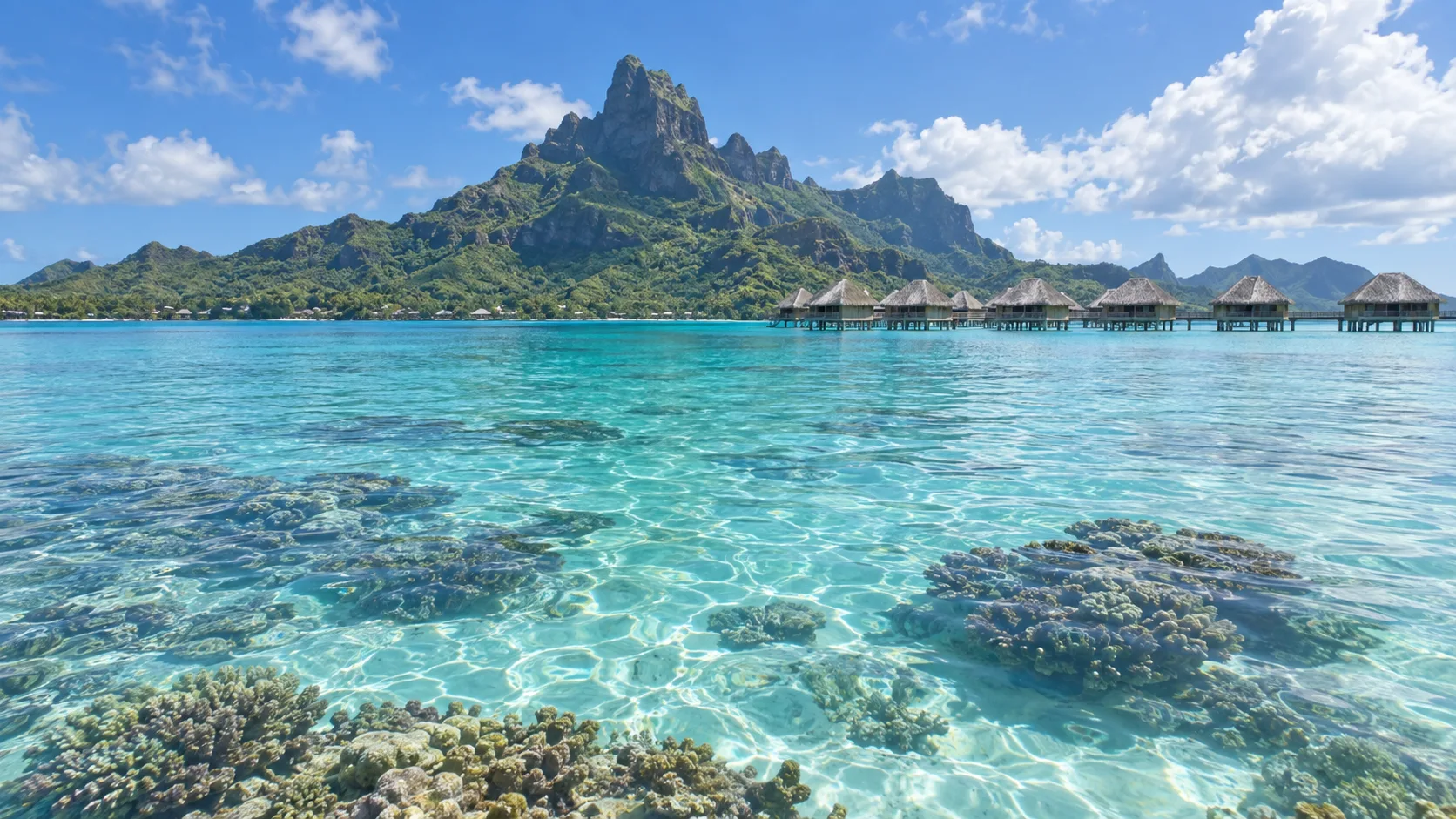 Mount Otemanu, clear coral lagoon and overwater bungalows in Bora Bora