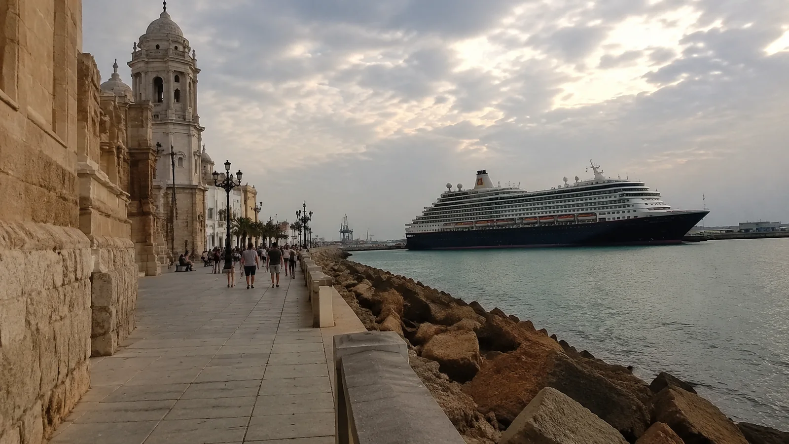 Historic waterfront promenade beside a docked cruise ship