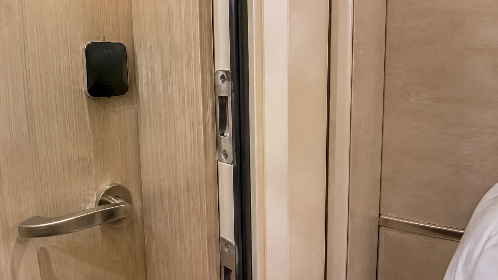 Close-up of a cruise cabin door handle and electronic lock