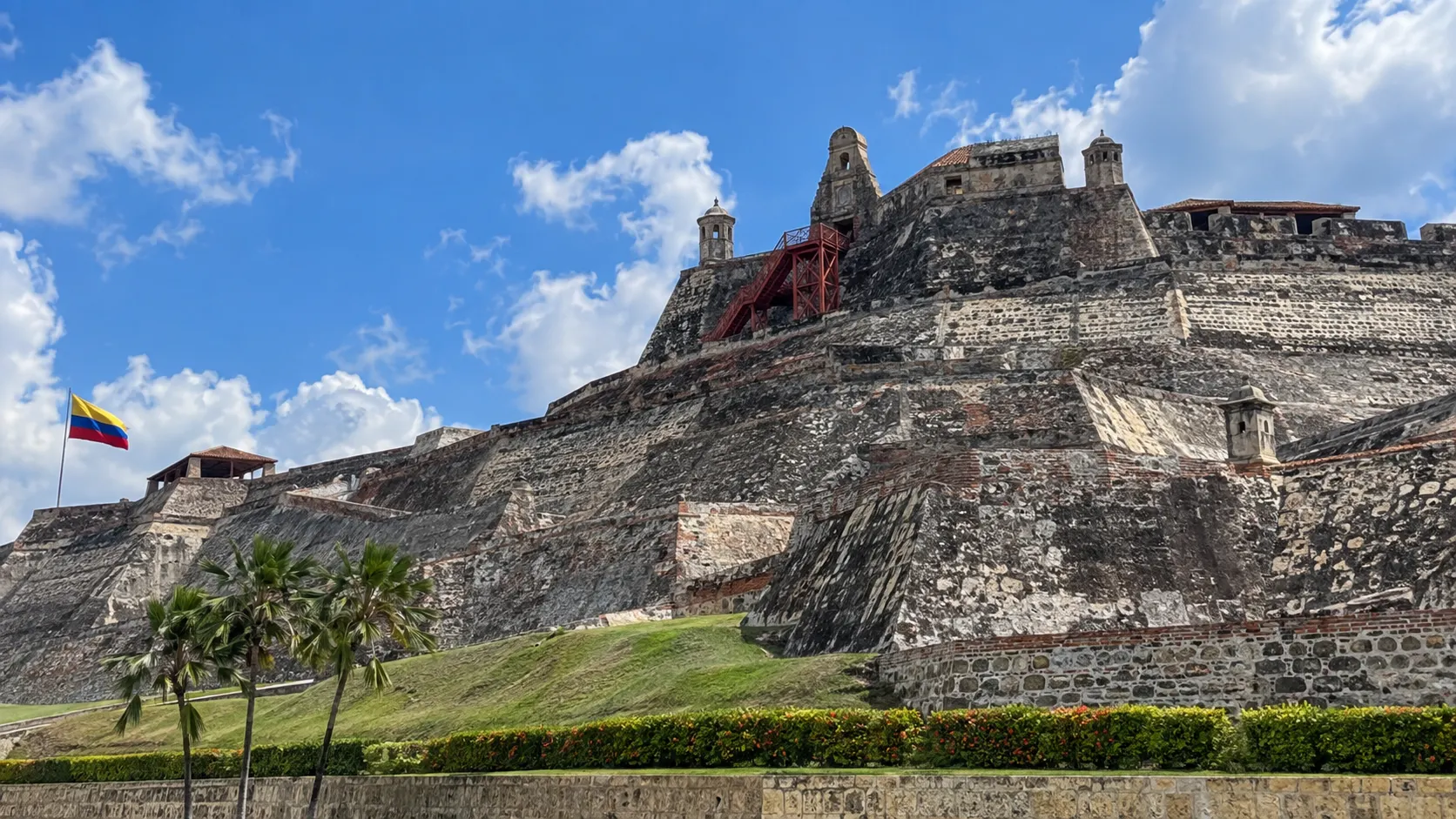 Massive stone ramparts of Castillo San Felipe de Barajas beneath a tropical sky.