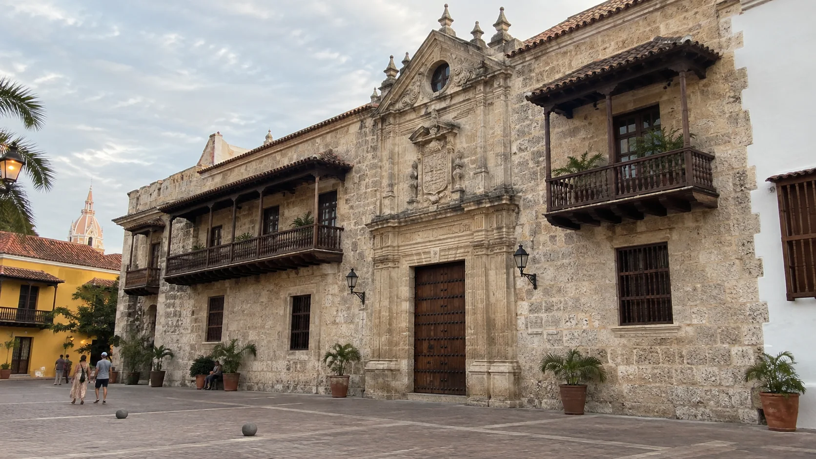 Colonial stone facade and wooden balconies of Cartagena's Palace of the Inquisition.