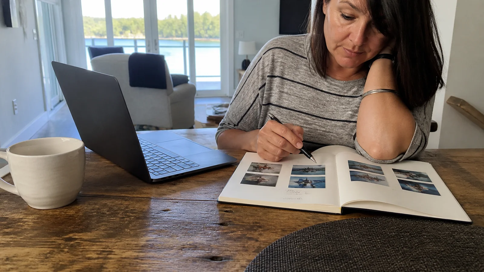 Traveler reviewing a brochure beside a laptop.