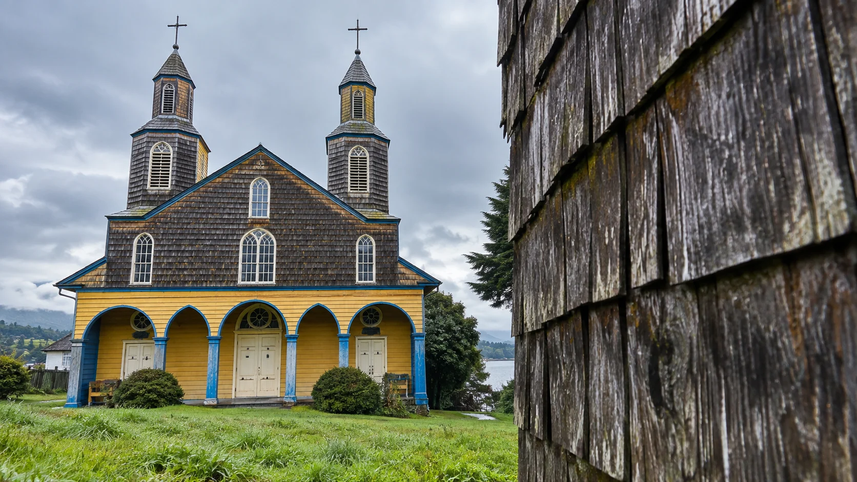 Colorful wooden UNESCO church and weathered shingles on Chiloé