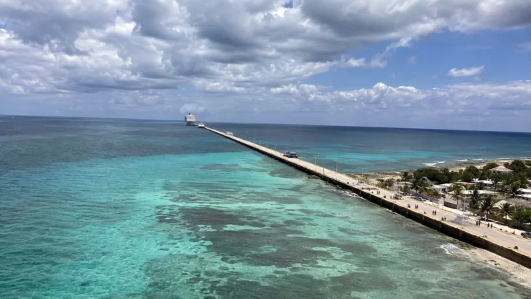 Long cruise pier extending across turquoise water