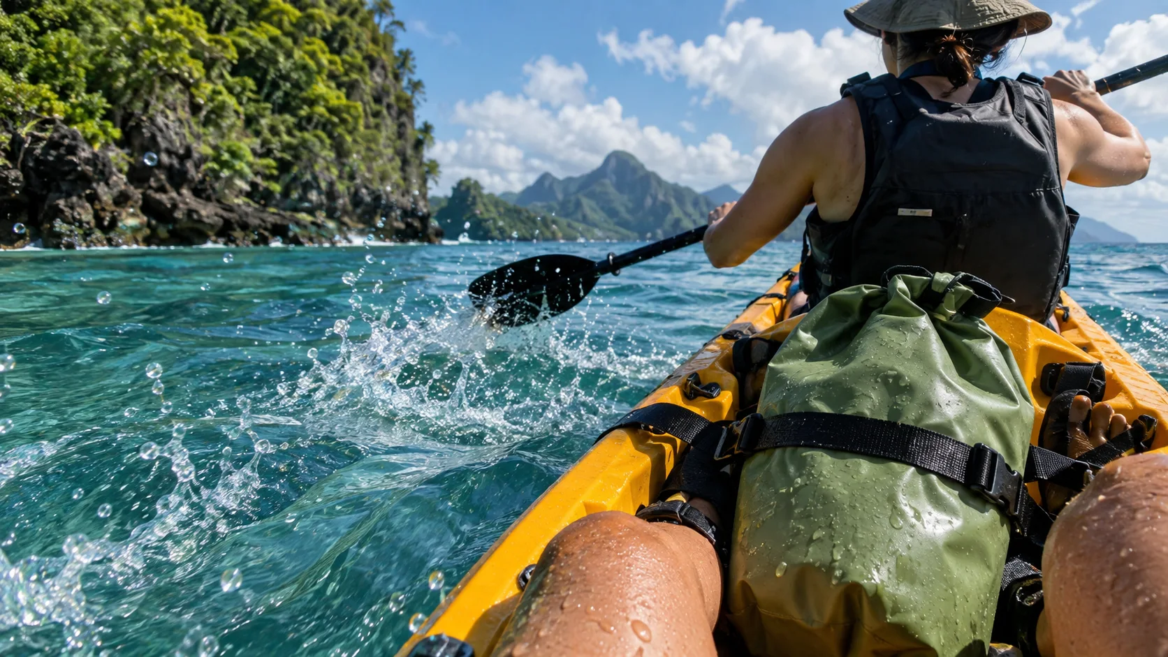 Small roll-top dry bag secured in a kayak during a tropical excursion.