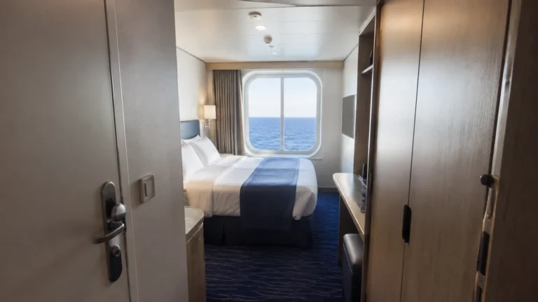Compact cruise cabin viewed through a narrow entrance passage.