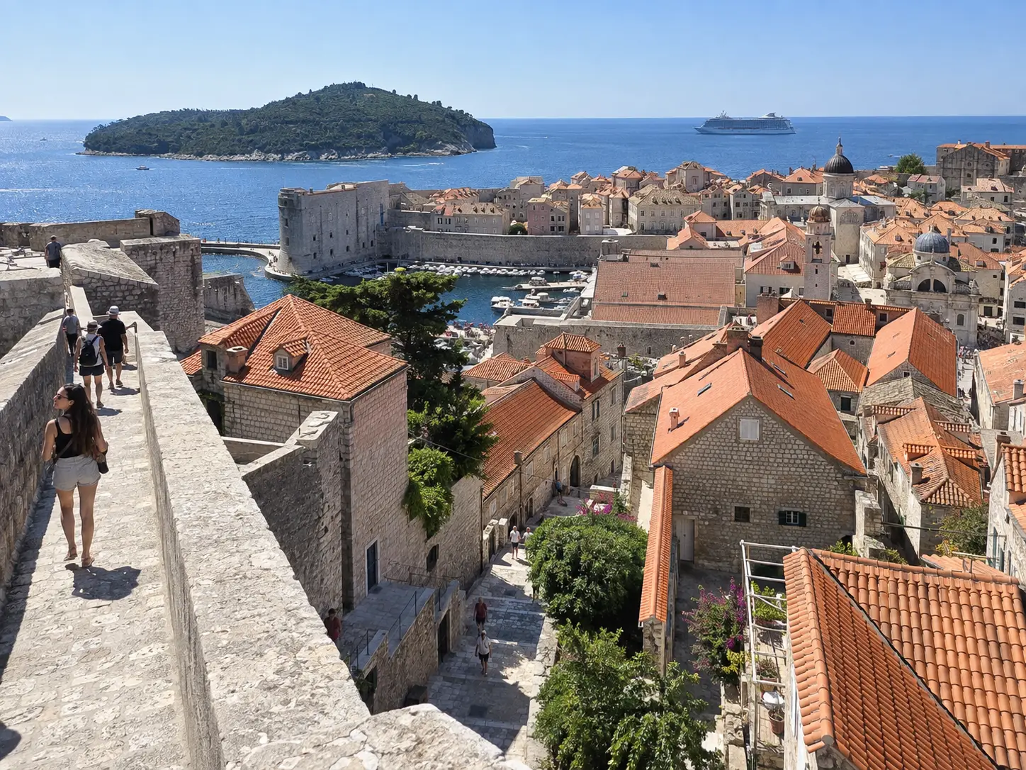 Terracotta rooftops and the Adriatic Sea spread below Dubrovnik's historic walls.
