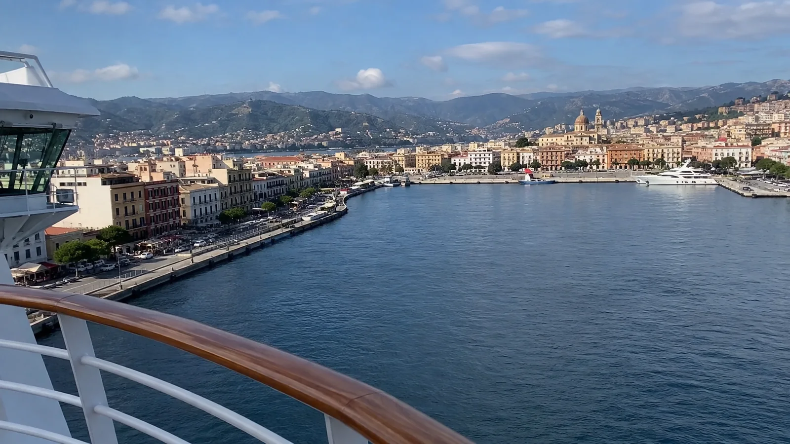 City waterfront and harbor viewed from a cruise ship railing