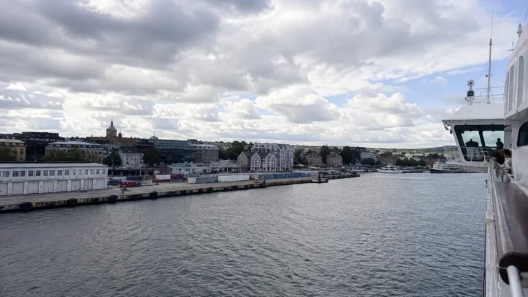 Waterfront city viewed from a cruise ship entering the harbor.