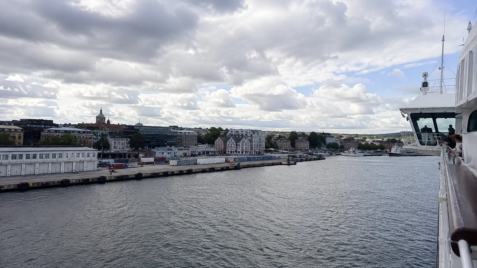 Waterfront city viewed from a cruise ship entering the harbor.