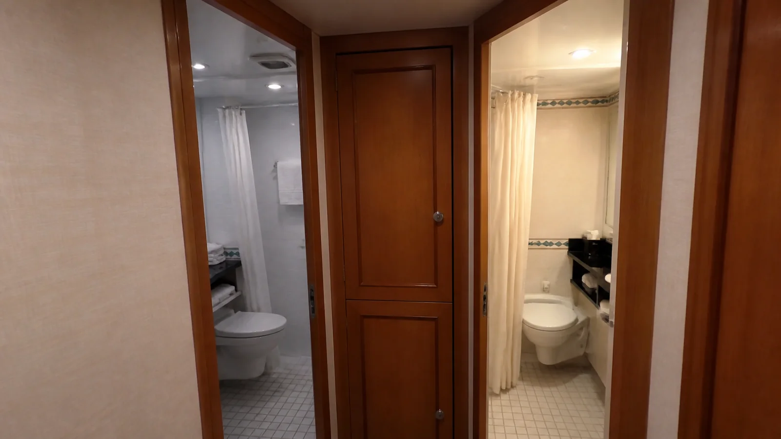 Doorways to separate bathroom areas in a cruise suite.