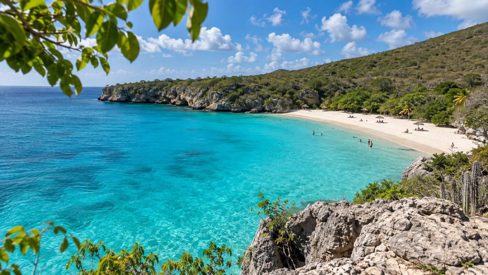 Turquoise water and white sand filling the broad cove at Grote Knip in Curaçao