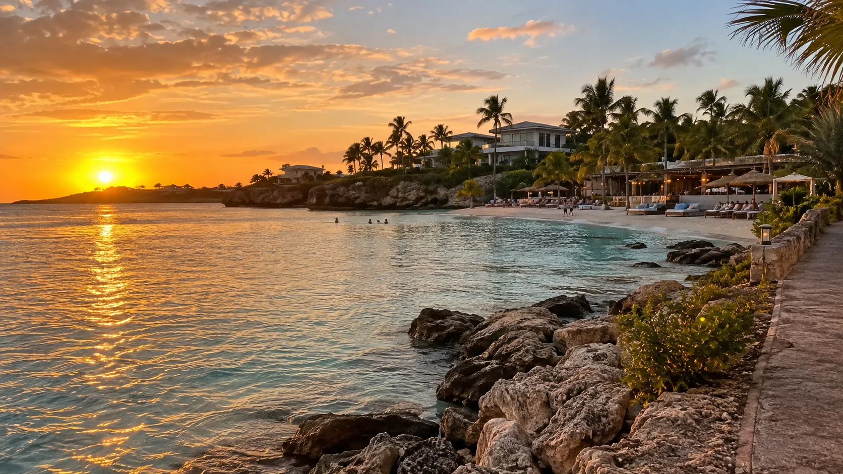 Golden sunset over the rocky shoreline and beach clubs at Jan Thiel in Curaçao