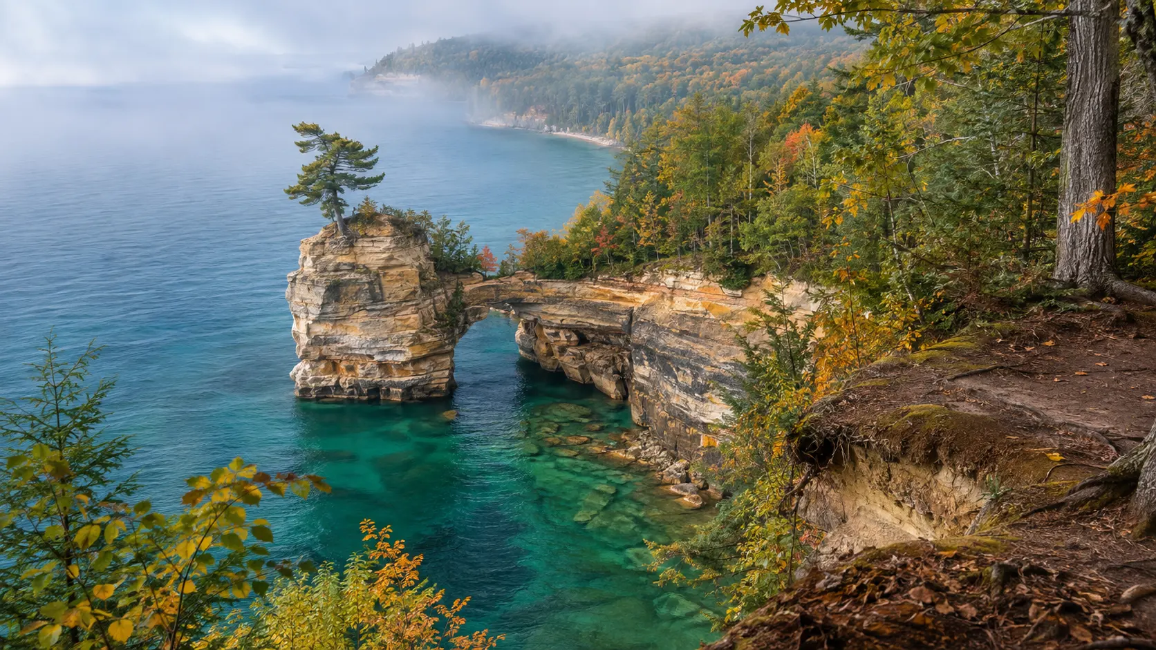 Chapel Rock and its lone pine above turquoise Lake Superior at Pictured Rocks