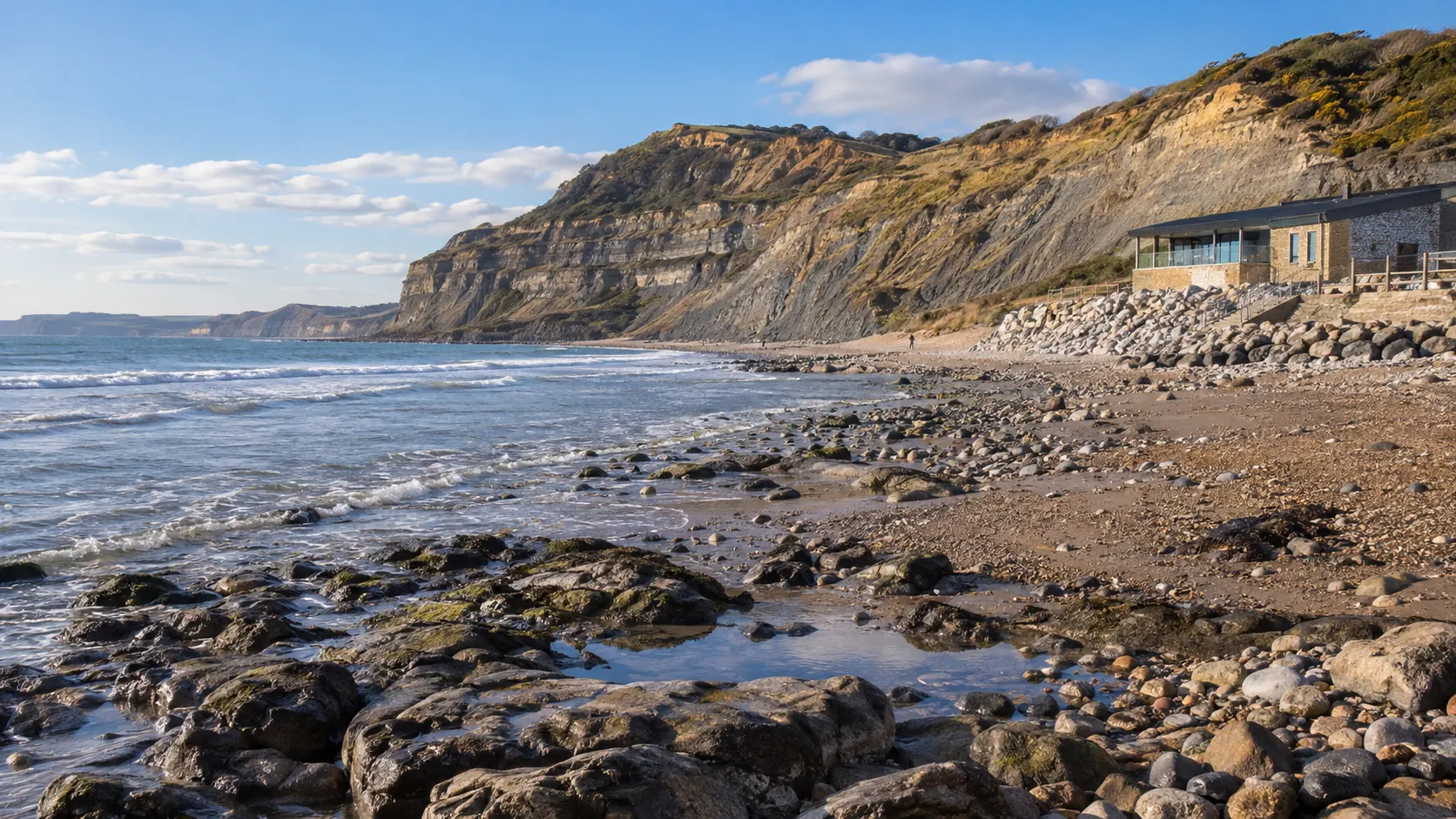 Fossil-hunting beach beneath the Jurassic cliffs at Charmouth.