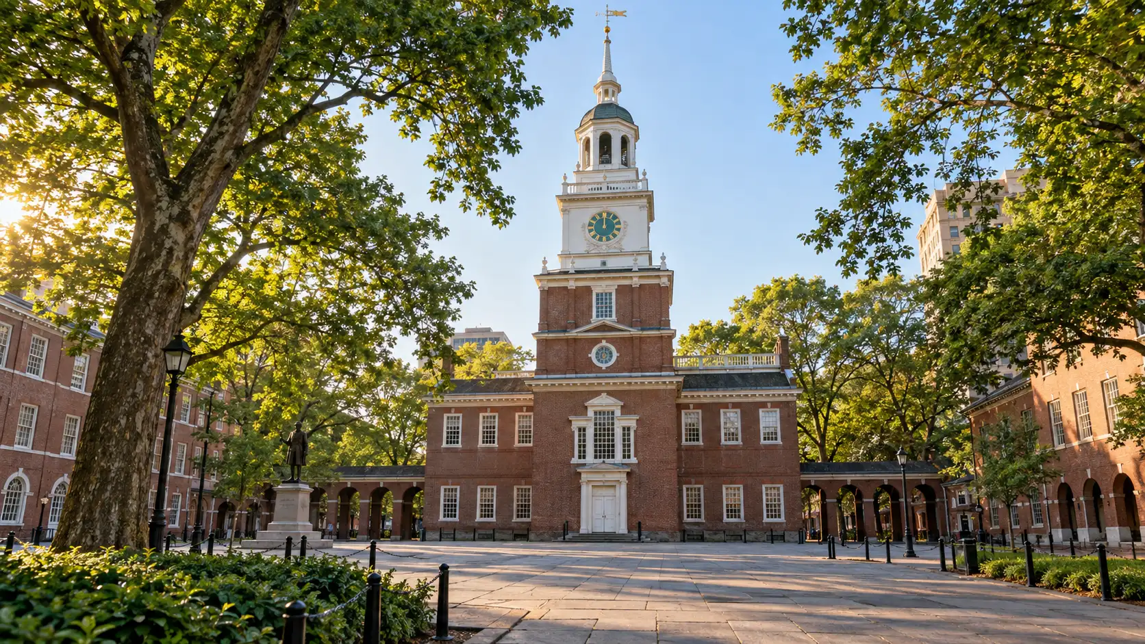 Independence Hall stands beyond a brick walkway in Philadelphia.